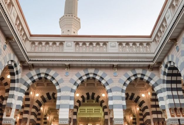 A stunning view of Al-Masjid an-Nabawi showcasing Islamic architecture with intricate arches.