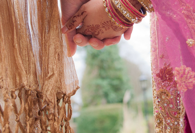 married-couple-holding-hands